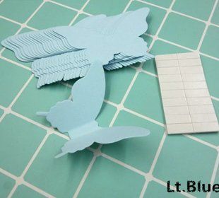 Декор стін метелики світло-блакитні - у наборі 20 штук розміром 8*5см, картон, є 2-х сторонній скотч Л104 фото